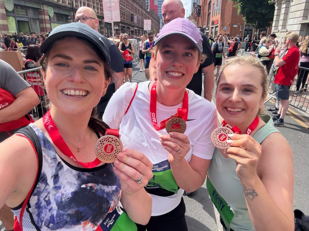 Pictured here with their medals, from left to right, Izzy, Amy and Kirsty